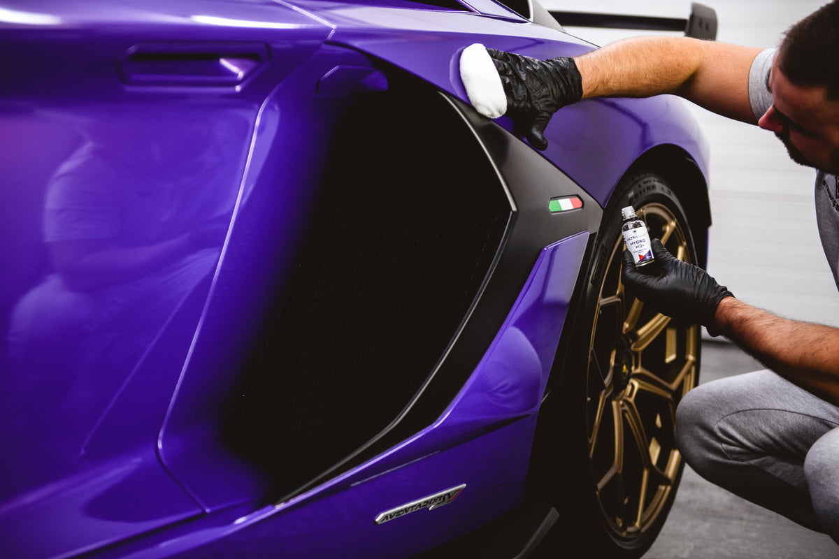 Ceramic coating being professionally applied to a vehicle at RevWorks Studio