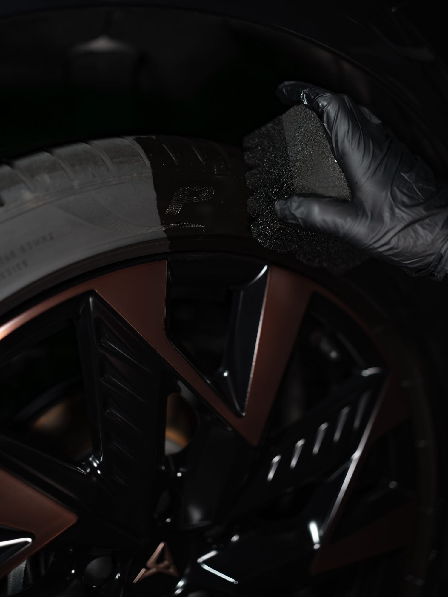 Tyre maintenance application on a bronze and black alloy wheel